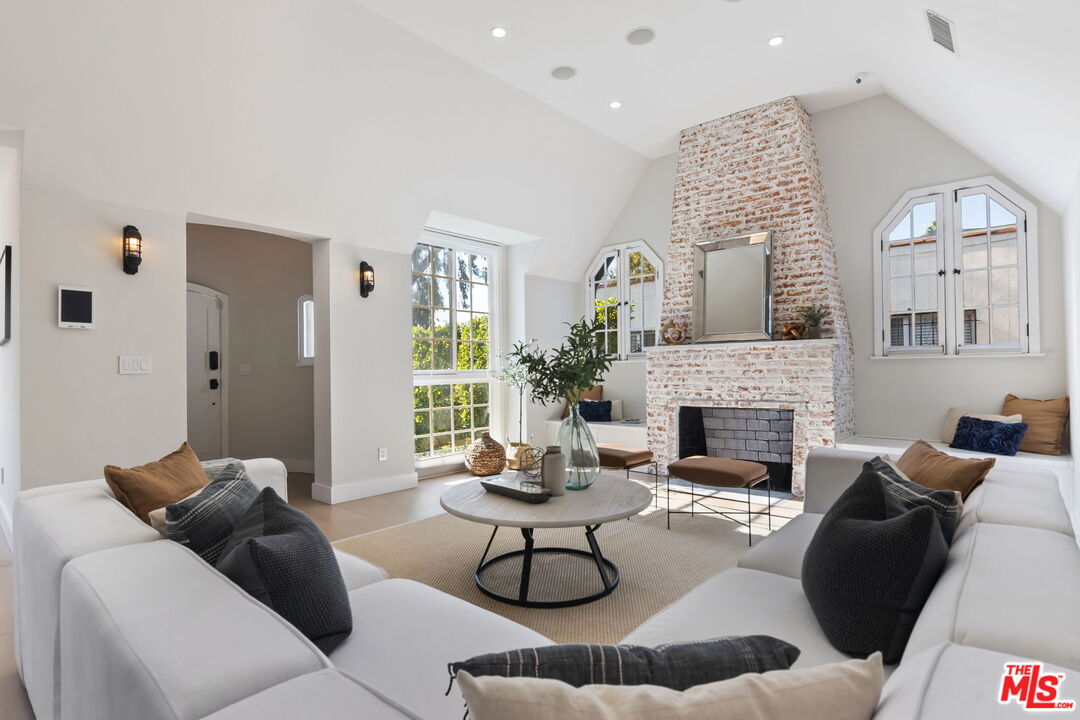 6507 West Olympic Boulevard Los Angeles, CA 90048 - Photo 7 of 50 a living room with furniture and a fireplace