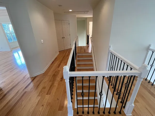 a white toilet sitting next to a bath tub
