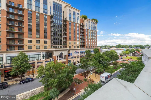 a bedroom with a bed and ceiling fan