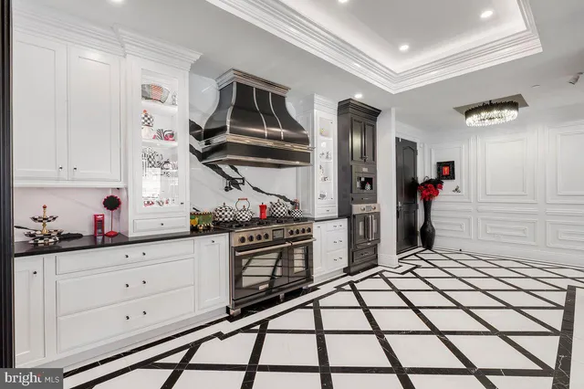 a kitchen with stainless steel appliances a sink and cabinets
