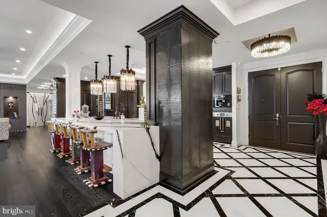 a view of a hallway with dining area
