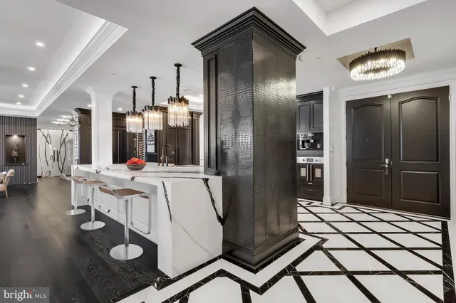 a kitchen with stainless steel appliances granite countertop a refrigerator and a sink