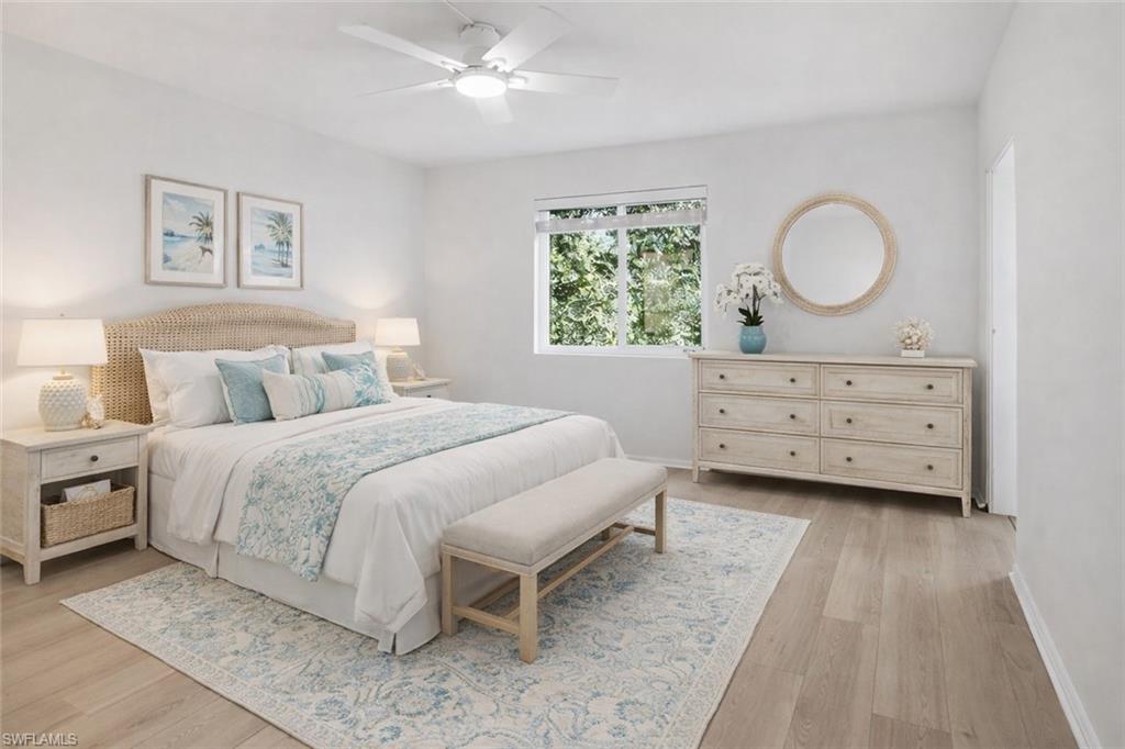 1001 Foxfire Lane, Unit 204 Naples, FL 34104 - Photo 14 of 35 a bedroom with a bed and a window