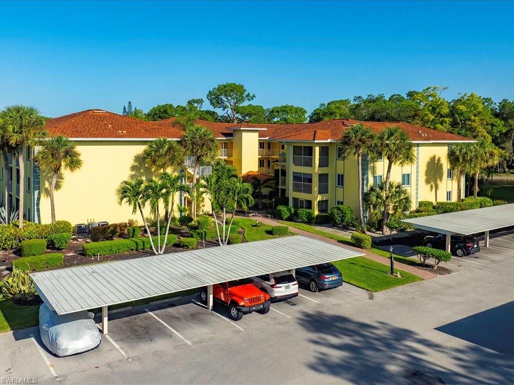 1001 Foxfire Lane, Unit 204 Naples, FL 34104 - Photo 27 of 35 an aerial view of a house with swimming pool garden and patio