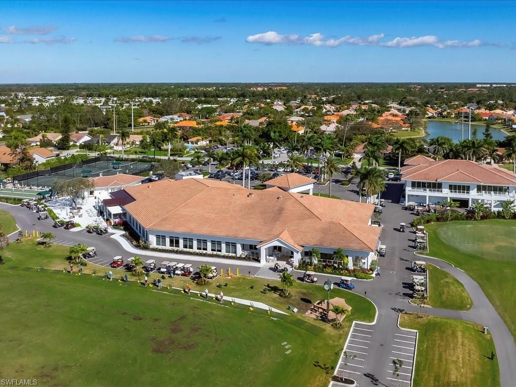 1001 Foxfire Lane, Unit 204 Naples, FL 34104 - Photo 31 of 35 an aerial view of residential houses with outdoor space and swimming pool