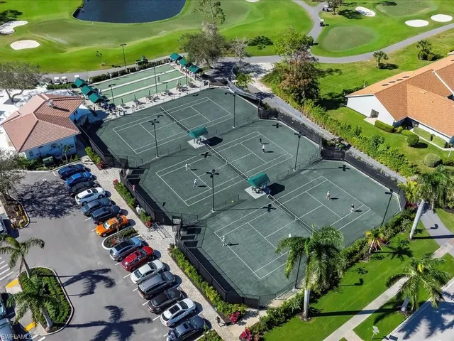 an aerial view of a houses with yard