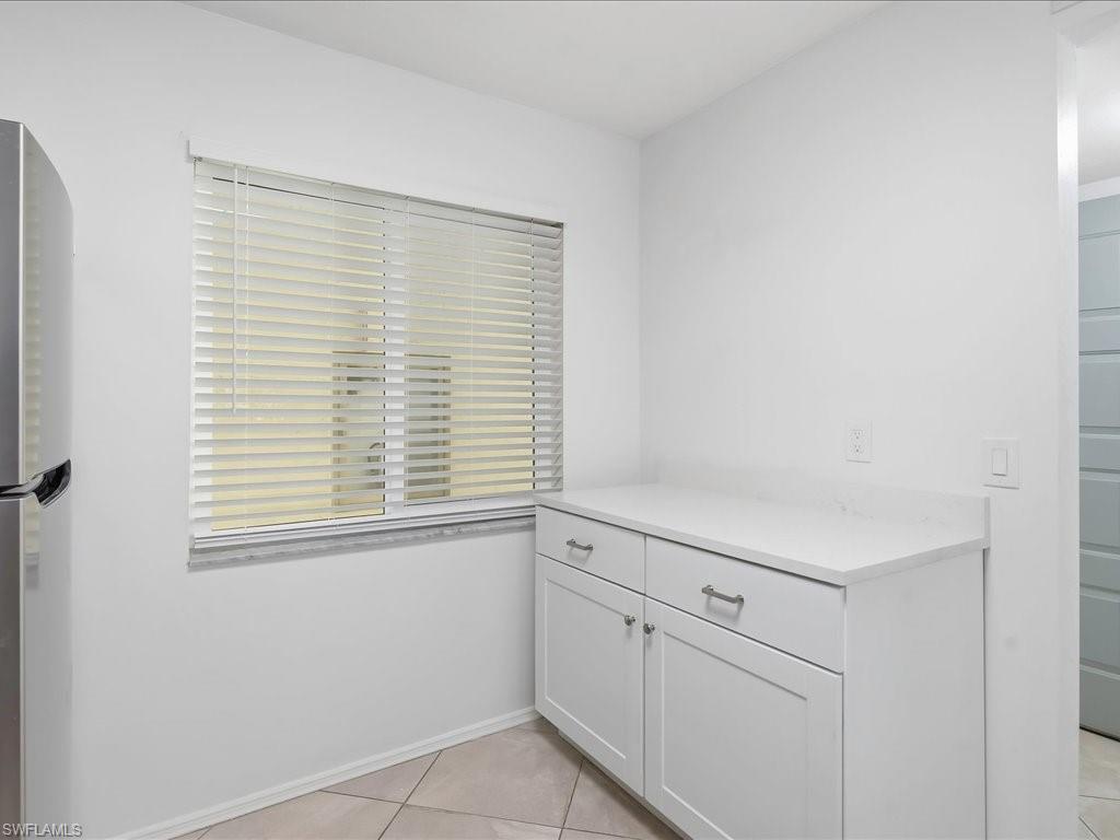 1001 Foxfire Lane, Unit 204 Naples, FL 34104 - Photo 5 of 35 a view of an empty room with a window