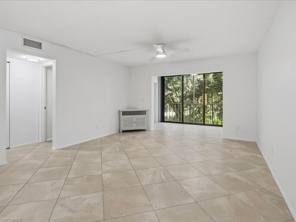1001 Foxfire Lane, Unit 204 Naples, FL 34104 - Photo 8 of 35 a view of an empty room with a window
