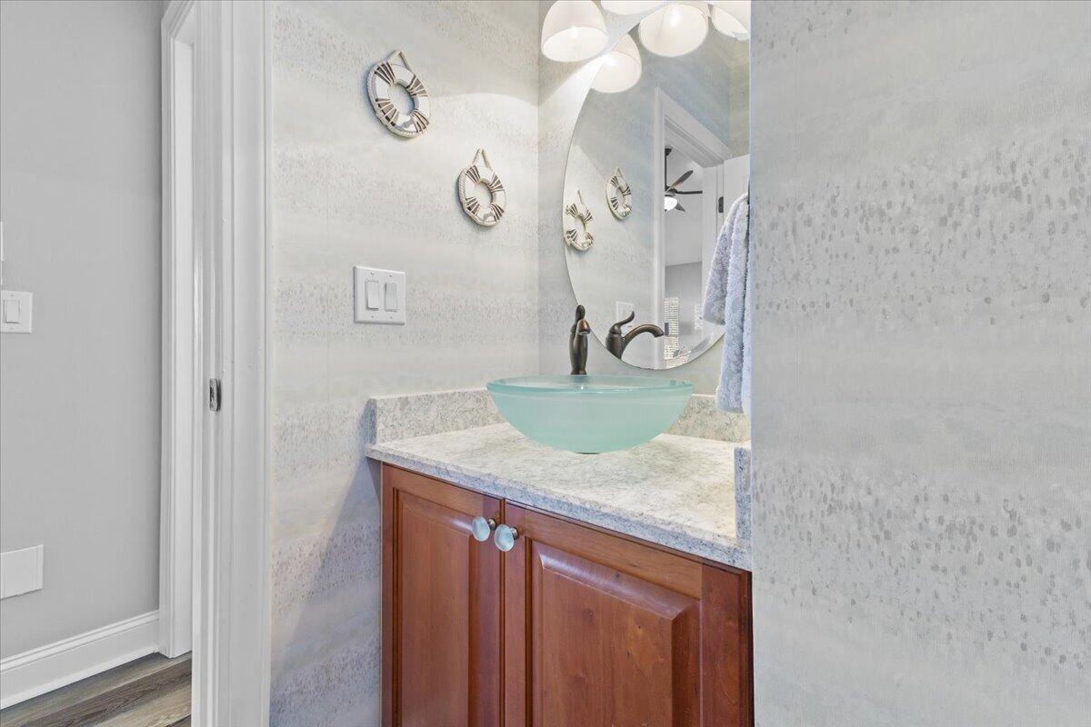 225 Lands End Circle Union Hall, VA 24176 - Photo 24 of 77 a bathroom with a granite countertop sink a mirror and vanity