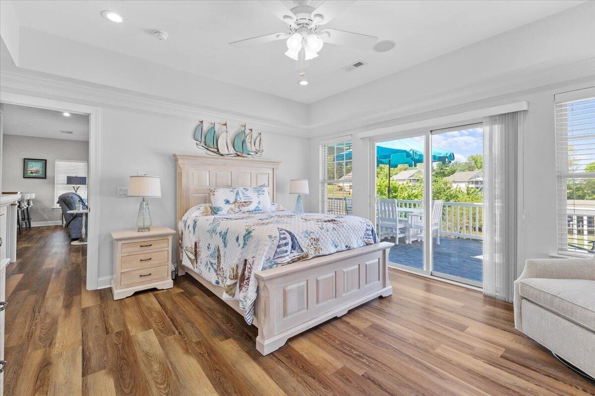 225 Lands End Circle Union Hall, VA 24176 - Photo 27 of 77 a bedroom with a large bed and a chandelier