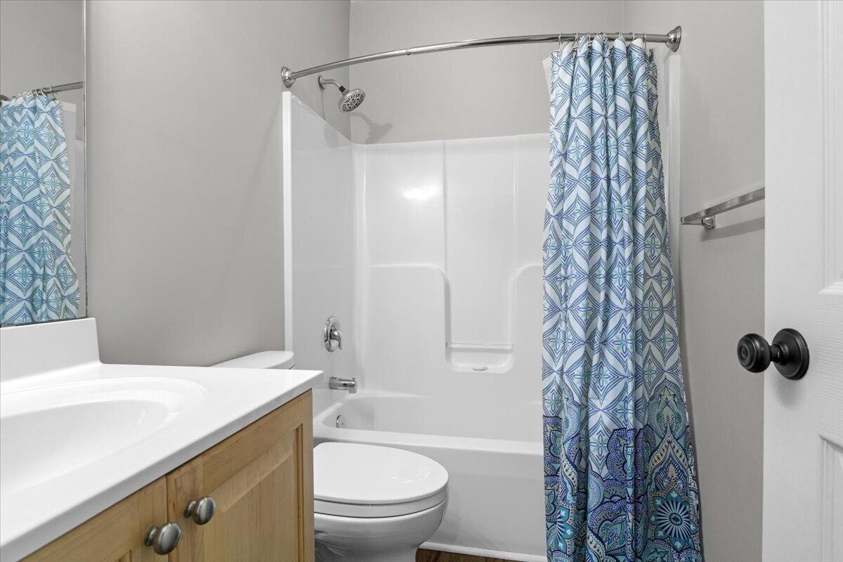 225 Lands End Circle Union Hall, VA 24176 - Photo 44 of 77 a bathroom with a shower curtain and a toilet