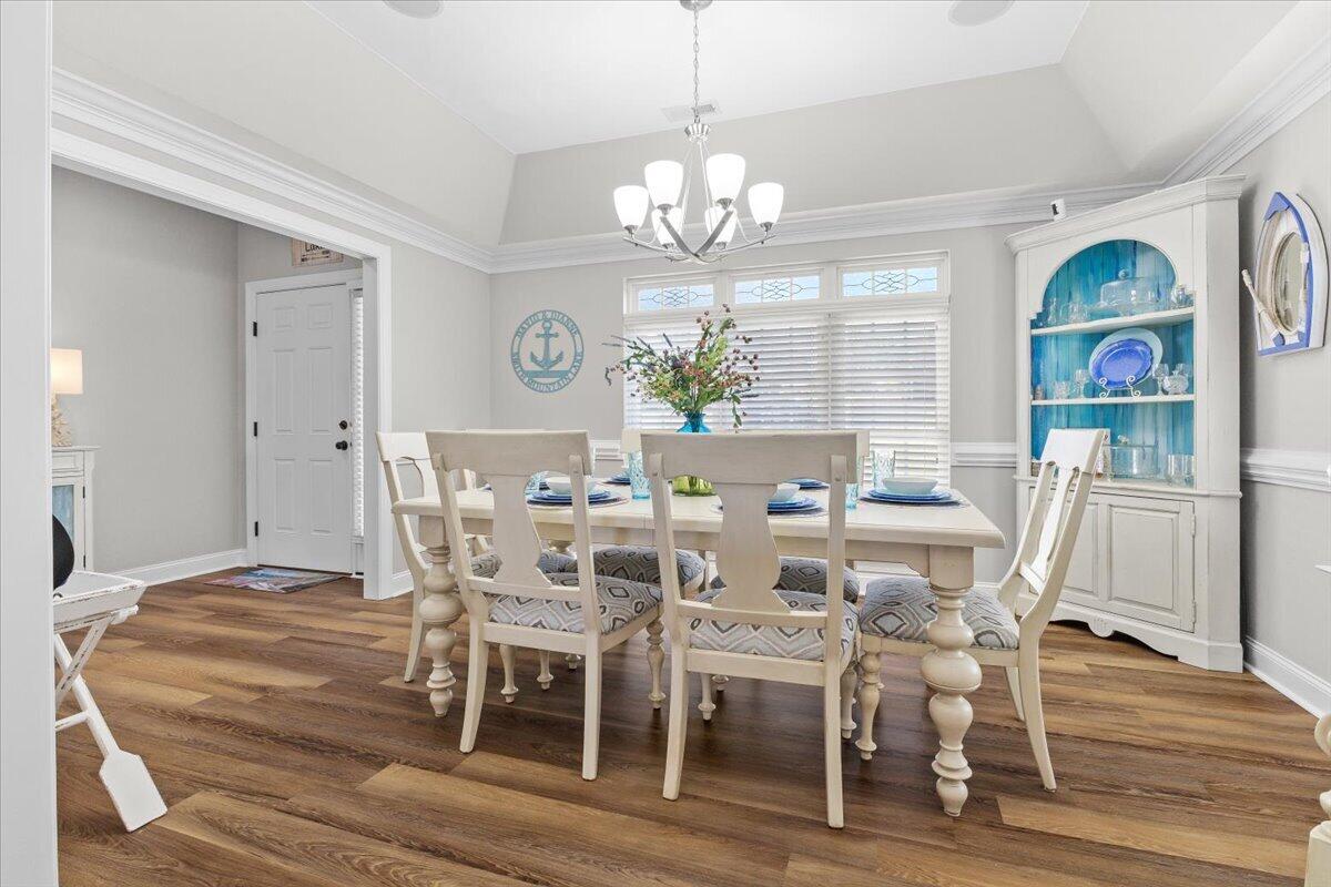 225 Lands End Circle Union Hall, VA 24176 - Photo 9 of 77 a view of a dining room with furniture a chandelier and wooden floor