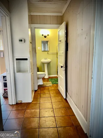 a bathroom with a sink and a toilet