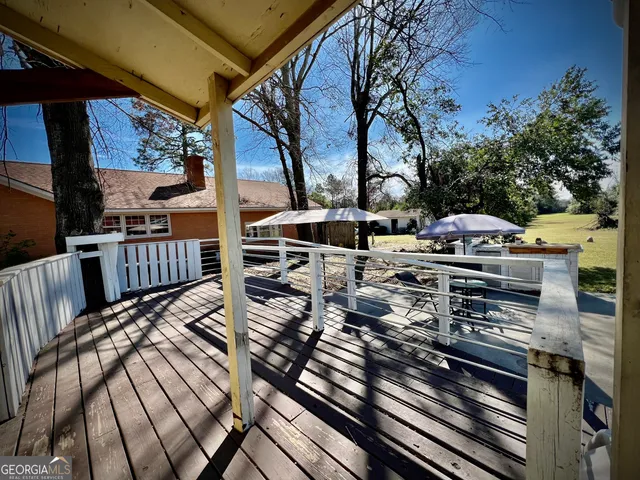 a view of a chairs and table in the balcony