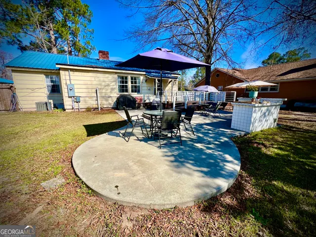 swimming pool view with a seating space