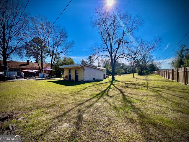 a house view with swimming pool in front of house