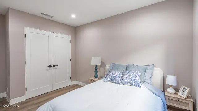 a view of a chair and table in the backyard