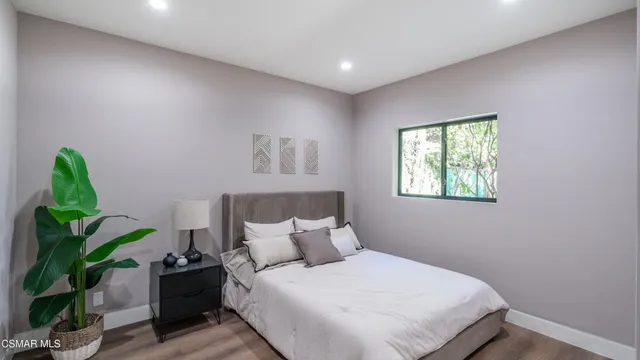a view of a porch with furniture and a yard