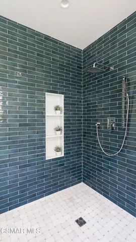 a aerial view of a house with a yard and potted plants