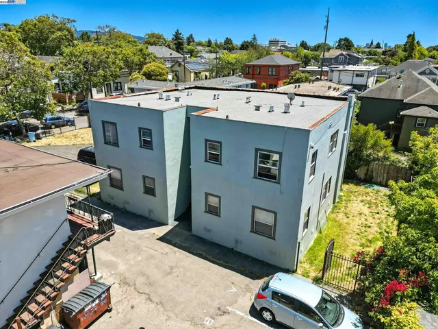 a view of a terrace with a table and chairs
