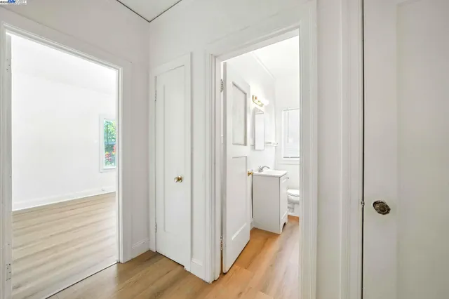 a view of a bathroom with wooden floor