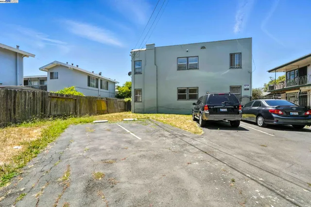 a view of a car park in front of a house