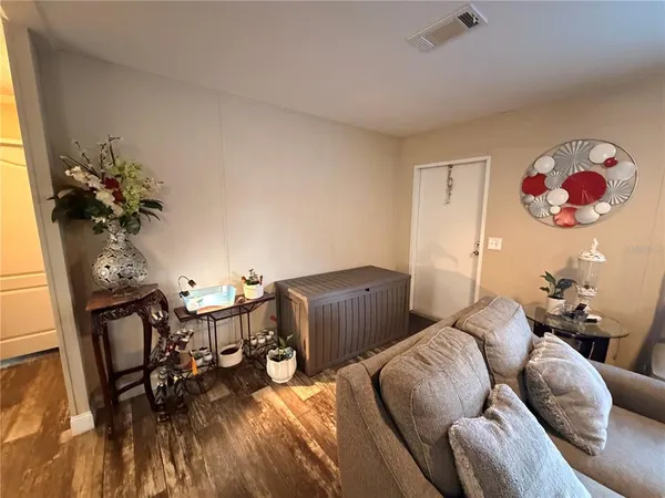 a kitchen with stainless steel appliances granite countertop a sink wooden cabinets and a refrigerator