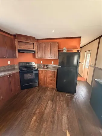 a view of kitchen with furniture and a window