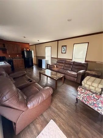 a yellow house with trees in front of it