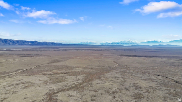 18150 South Allens Rnch Road West Cedar Valley, UT 84013 - Photo 14 of 15 Aerial view of sparsely populated area featuring a mountainous background and a desert landscape