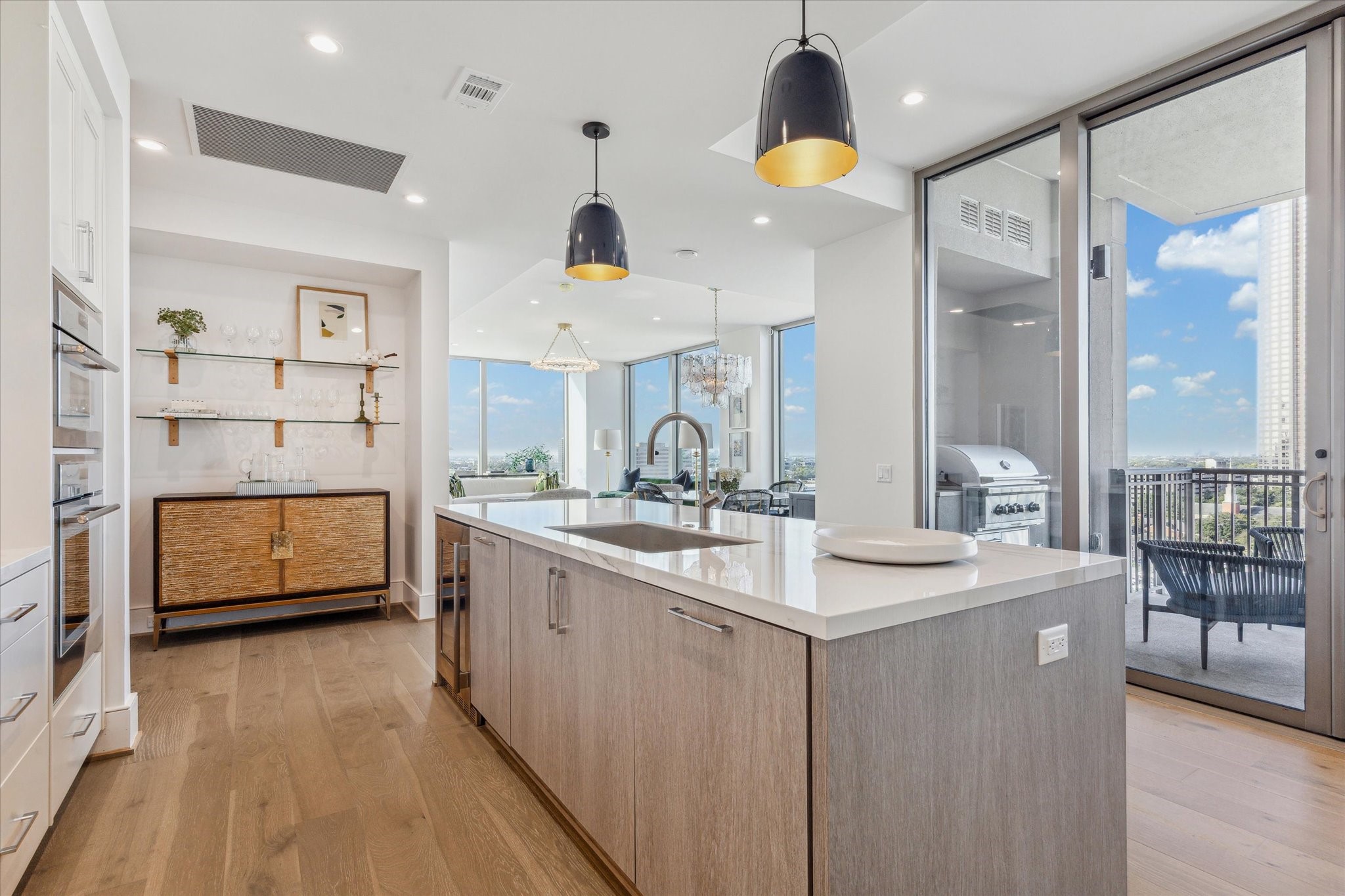 5656 San Felipe Street, Unit 1205 Houston, TX 77056 - Photo 26 of 45 a kitchen with stainless steel appliances granite countertop a sink a stove and a wooden floors