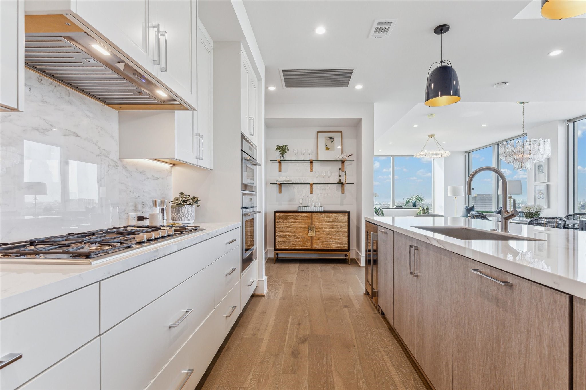 5656 San Felipe Street, Unit 1205 Houston, TX 77056 - Photo 28 of 45 a kitchen with stainless steel appliances a stove a sink and a wooden cabinets