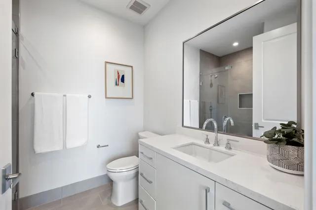 a view of a swimming pool with outdoor seating and a floor to ceiling window