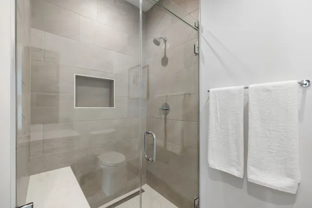 a view of a balcony with chairs and a table