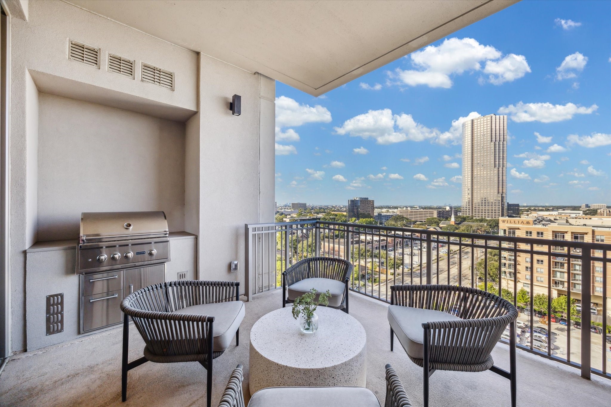 5656 San Felipe Street, Unit 1205 Houston, TX 77056 - Photo 21 of 45 a balcony with a table and chairs