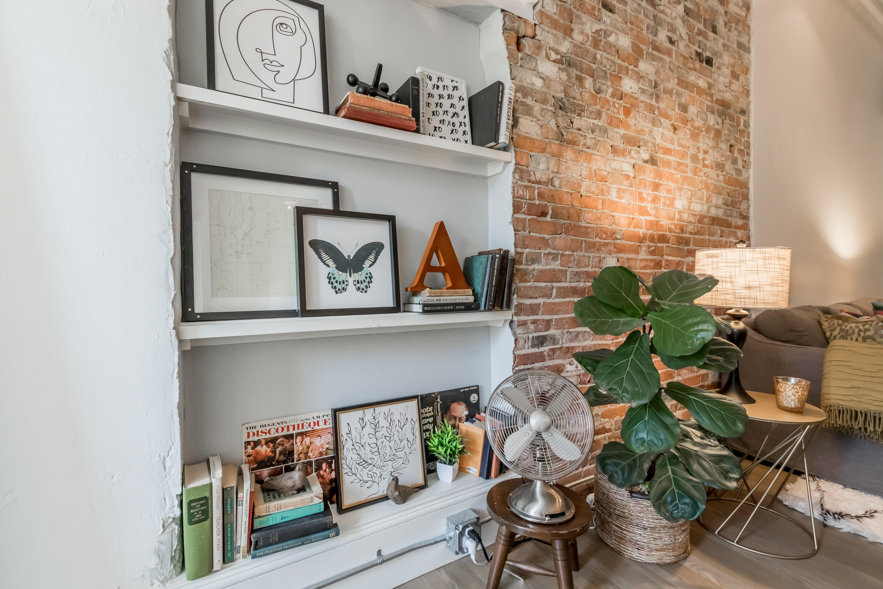 10 Exchange Street, Unit 307 Portland, ME 04101 - Photo 19 of 29 Exposed brick and Built-In Bookshelf