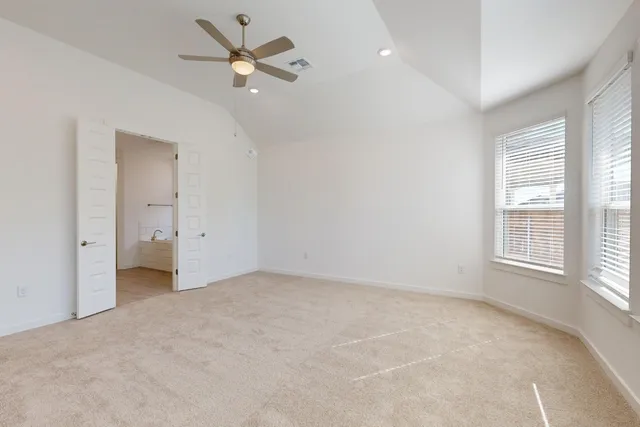 a view of an empty room with a window