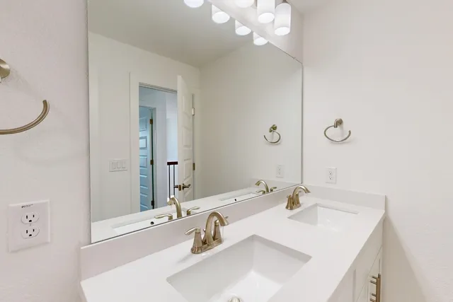 a view of an empty room and a window