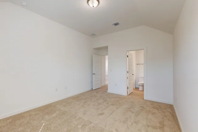 a bathroom with a sink vanity mirror and toilet