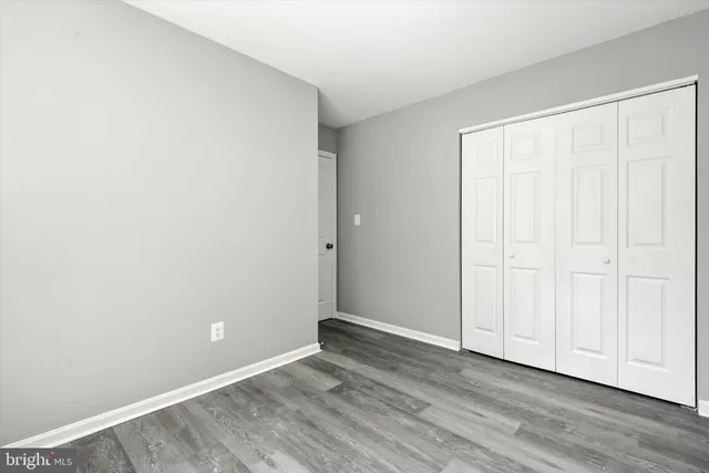 a view of room with wooden floor