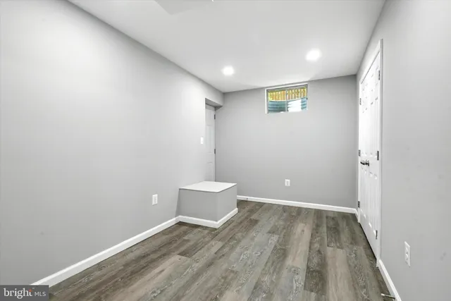 a bathroom with a sink vanity granite tub shower and mirror
