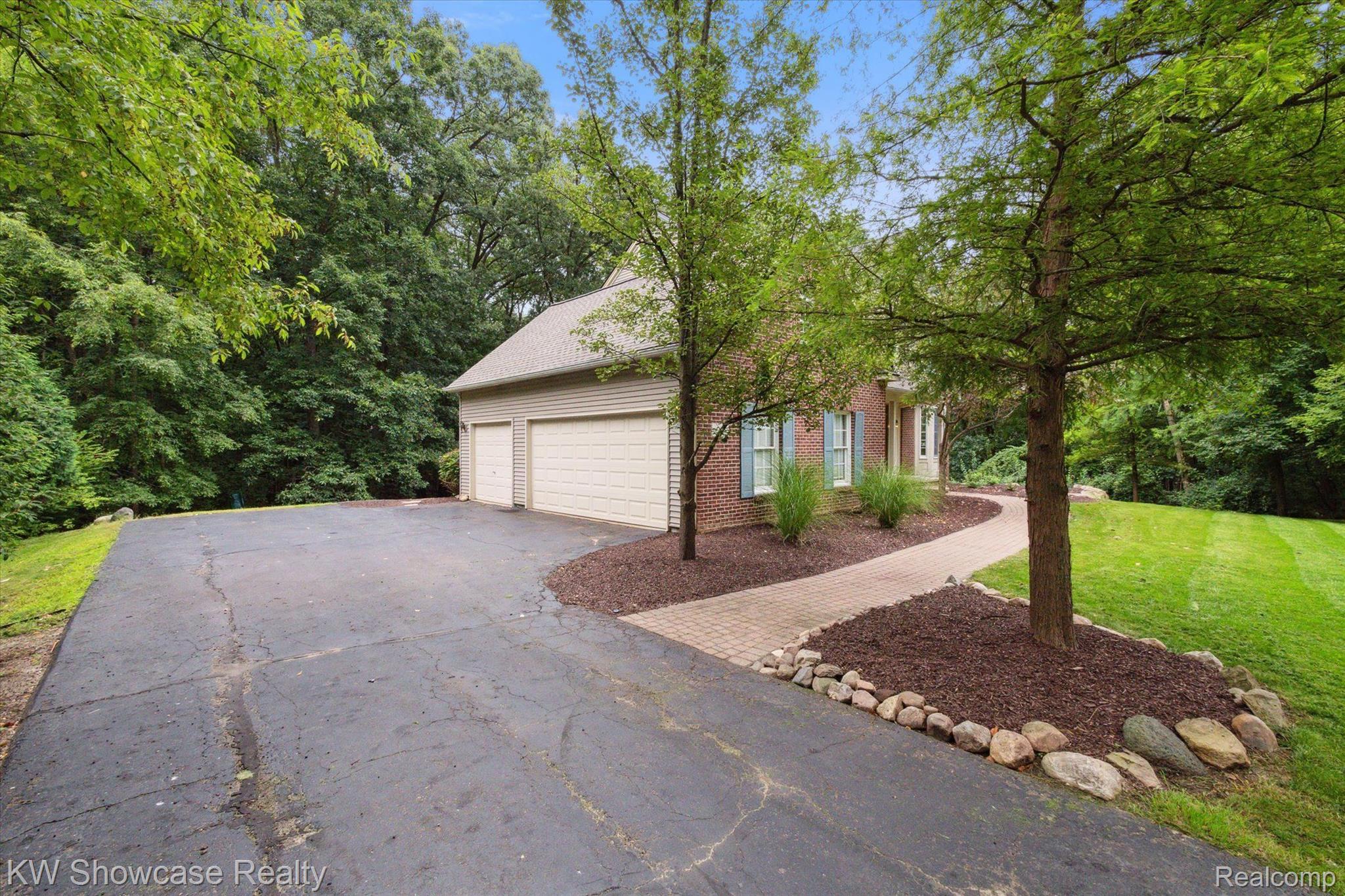 564 Timber Ridge Drive Highland, MI 48357 - Photo 33 of 40 Your new 3 car attached garage!