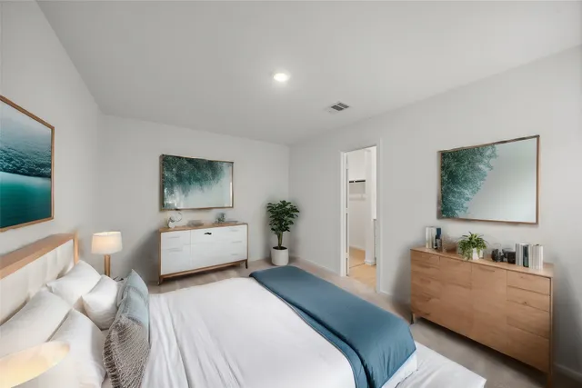 a bedroom with furniture and a window