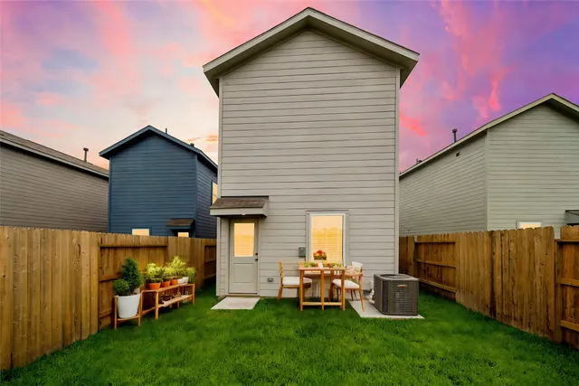 a front view of a house with patio and yard