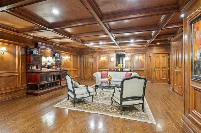 a dining room with furniture and a kitchen view