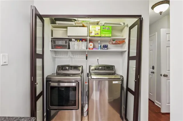 a kitchen with stainless steel appliances granite countertop a stove and a refrigerator