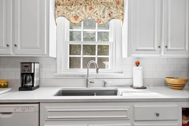 a view of hallway with wooden floor and livingroom view