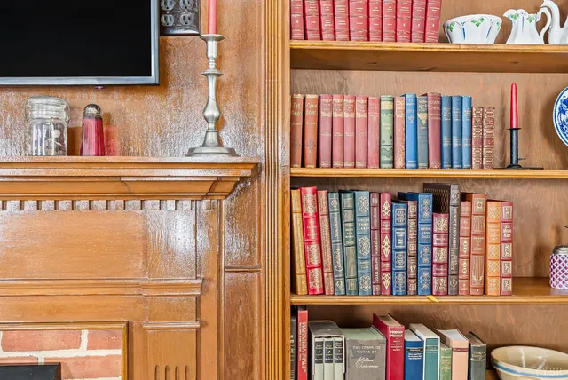 a bathroom with a sink toilet and window