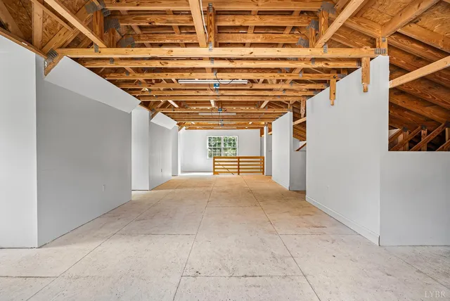 an aerial view of a house with swimming pool and garden view