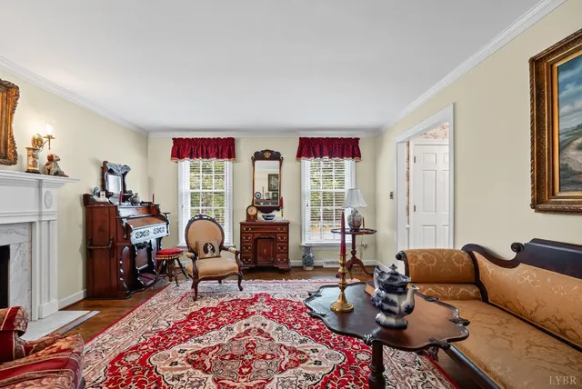a view of a dining room and livingroom with furniture